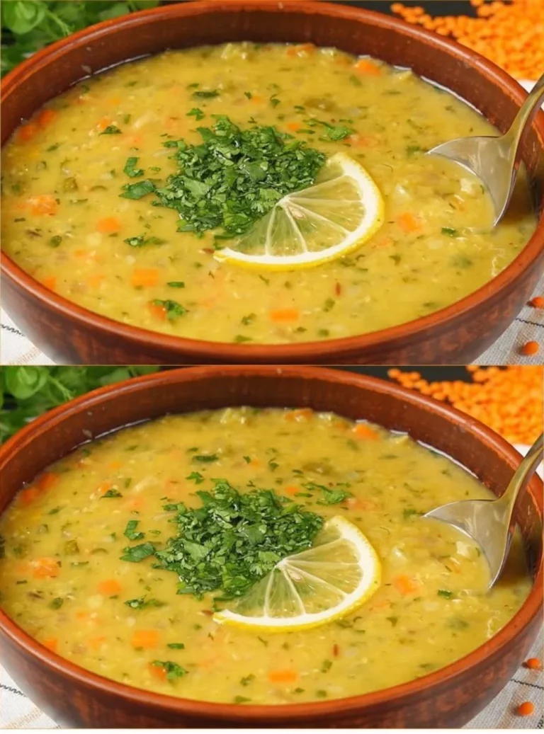 Bowl of homemade lentil soup garnished with fresh herbs