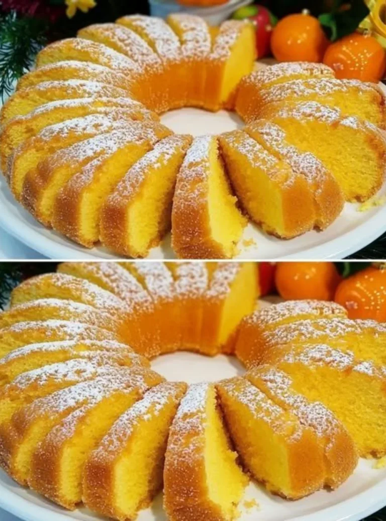 Delicious slice of orange cake topped with orange zest and frosting