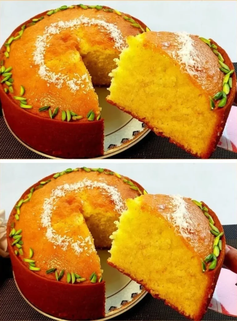 Deliciously baked orange cake topped with orange slices and icing.