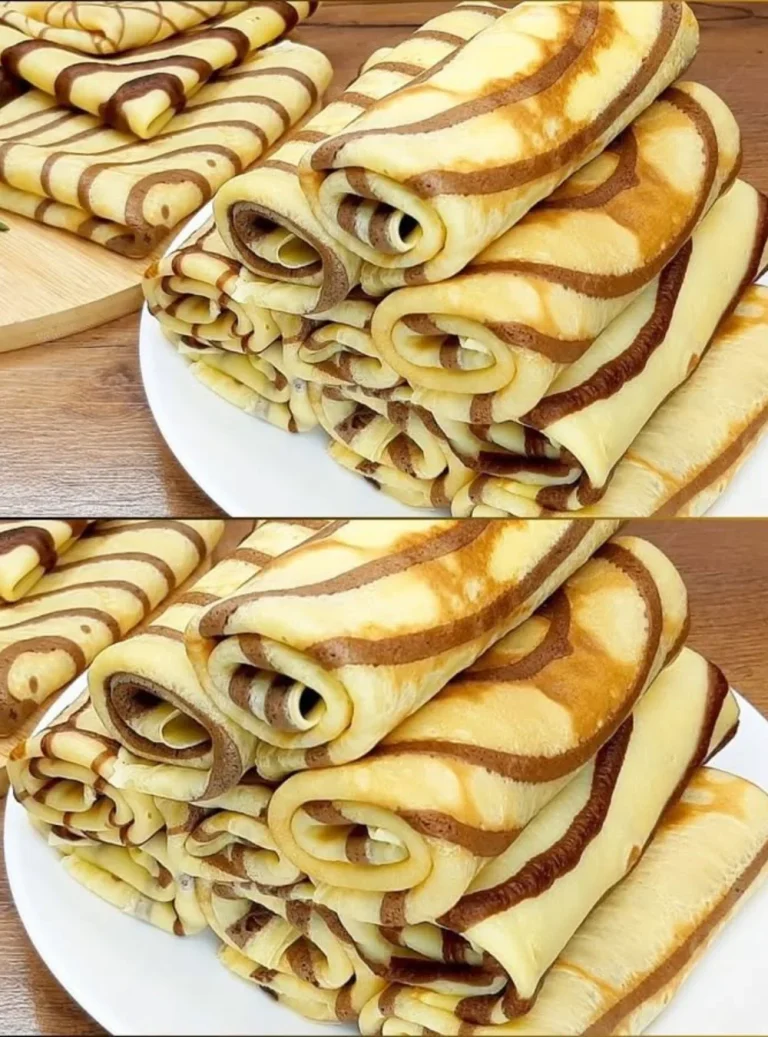 Delicious homemade crepes with various fillings showcased on a plate.